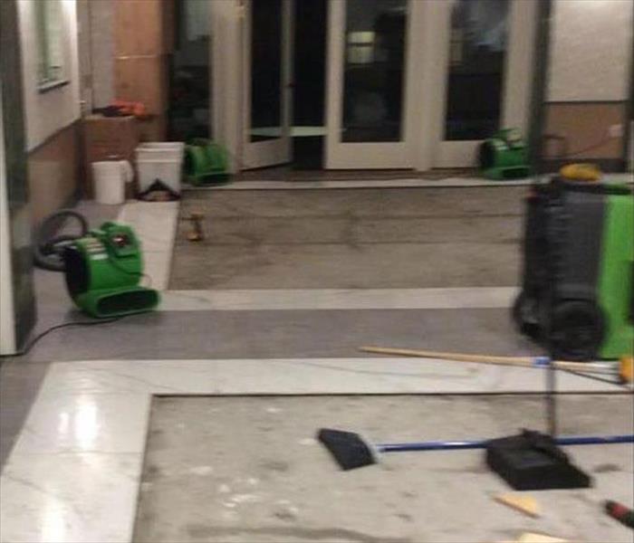 equipment drying out and cleaning the surface in the lobby
