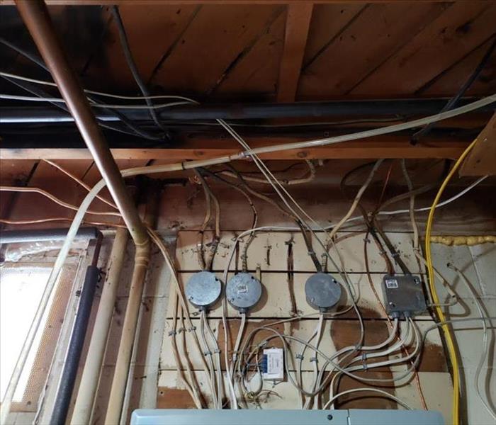 wall and ceiling with electric, plumbing, and asbestos insulation