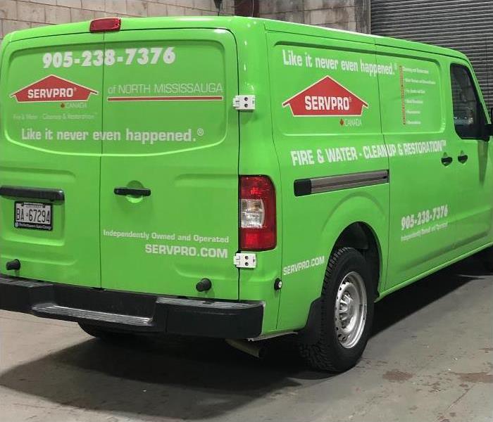 SERVPRO van parked in a warehouse