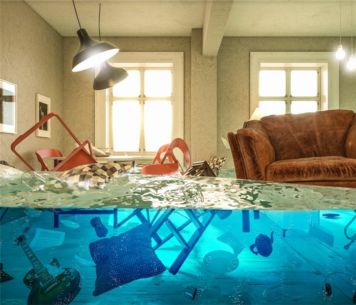 flooded living room with couch and other furniture floating